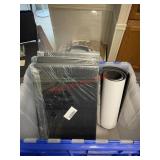black PVC sheets and a rolled foam mat. (Dinning