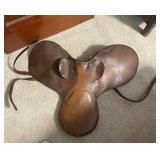brown leather English saddle. (Master upstairs )