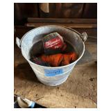 Metal bucket with tape measures (barn)