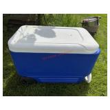 Blue rolling cooler                  (Outside of