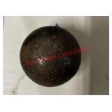 Appears to be an old cannonball (Garage)
