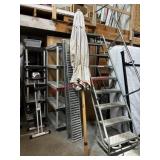 beige patio umbrella ( row d)
