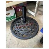 black cast iron patio umbrella base ( row D)