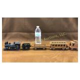 Early cast iron train (missing truck on caboose)