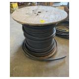 LARGE SPOOL OF HYDRAULIC HOSE