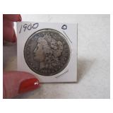 1900o Morgan Silver Dollar in sleeve darker