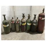 7 small gas oxygen acetylene tanks empty