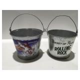 two metal drink buckets