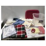 Table covers, table, runners, and more in a tote