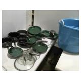 Pots and pans in a large tub