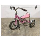 Pink Schwinn tricycle
