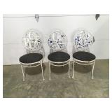 Three metal outdoor chairs