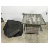 Outdoor fire pit with tank