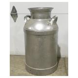 Metal milk can no lidHoles in bottom