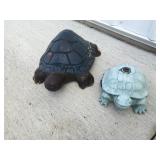 2 outdoor turtles one is a sprinkler