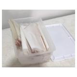 Plastic tote full of bags