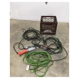 Milk crate with miscellaneous electric cords and