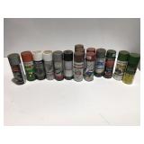 Spray paint cans, mostly full