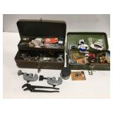 Two boxes with plumbing tools and parts