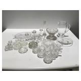 Clear glass items pitcher, candle holders and