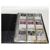 Pokï¿½mon cards in a binder