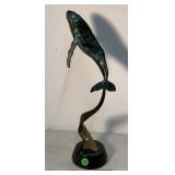 Bronze leaping whale