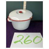 White over red enameled pot with lid