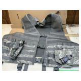 Desert camo utility vest with holster and flash