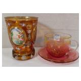 Decorative glass, cranberry teacup and saucer Decorative glass, cranberry teacup and saucer