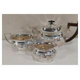 Possibly sterling silver teapot, cream and sugar Possibly sterling silver teapot, cream and sugar