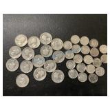 Assortment of silver dimes and silver quarters Assortment of silver dimes and silver quarters