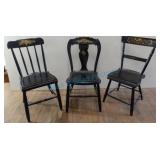 Three old black and gold painted chairs Three old black and gold painted chairs