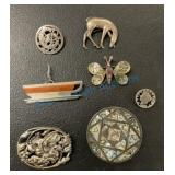 Group of silver brooches Group of silver brooches