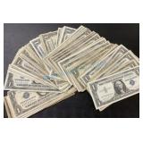 Stack of 76, one dollar silver certificates Stack of 76, one dollar silver certificates