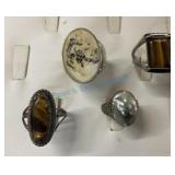 Group of four silver rings with various stones Group of four silver rings with various stones