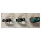 Group of three silver rings with inlaid turquoise Group of three silver rings with inlaid turquoise