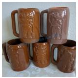 Five clay mugs Five clay mugs