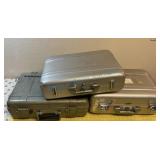 Group of three rigid equipment travel cases Group of three rigid equipment travel cases