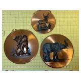 Three copper wall hangings as found Three copper wall hangings as found