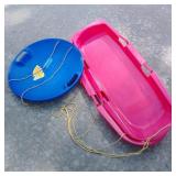 Two Plastic Sleds