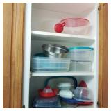 Lot of Plastic Storage in Cabinet Lot of Plastic Storage in Cabinet