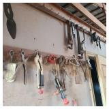 Wall of Tools by Door w/ Pipe Wrenches & Plane