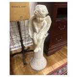 Cherub statue on stand