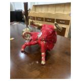 Red and gold bull figure
