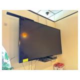 Wall-mounted flat screen TV with bracket