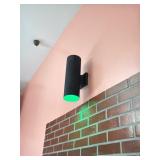 Wall-mounted cylindrical black wall sconce