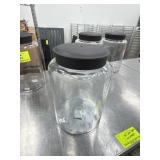 4 clear glass jars with lids
