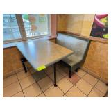 Restaurant booth with table and bench