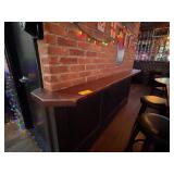 Wood Bar Counter Against Brick Wall
