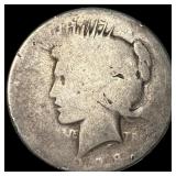 This is a heavily worn 1921 Peace Dollar. NICELY C
